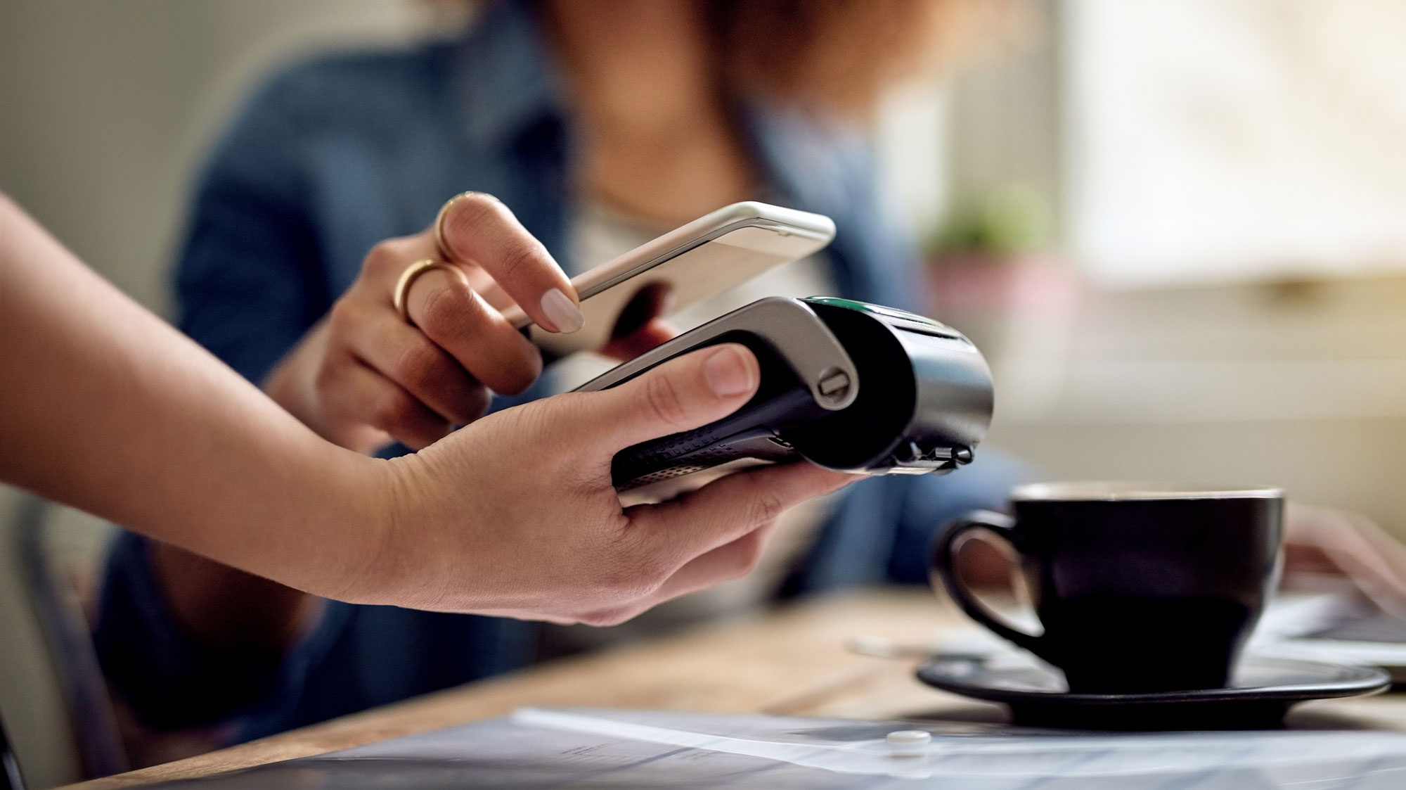 person paying with phone