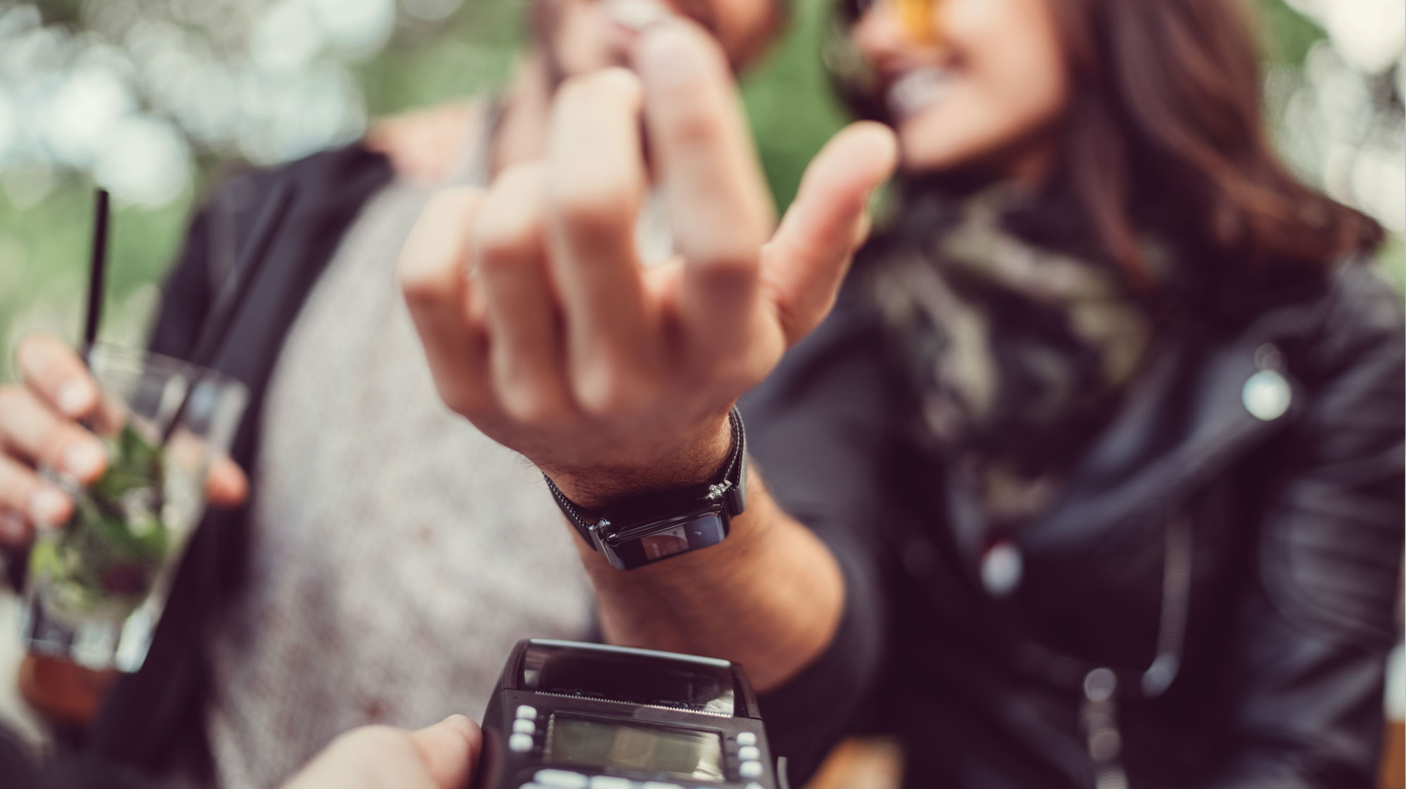 person paying with watch