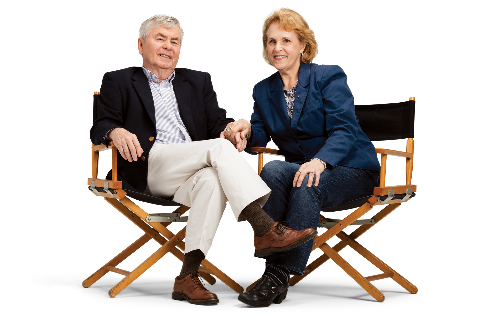 Happy Elderly Couple sitting in directors chairs