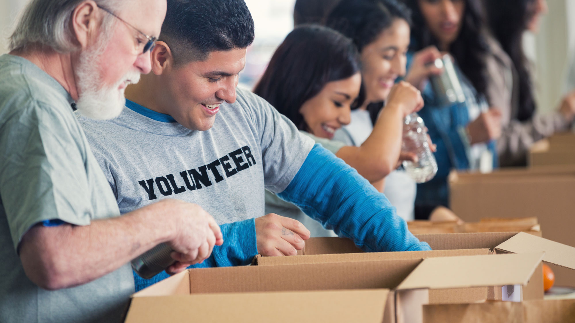 volunteer opening boxes