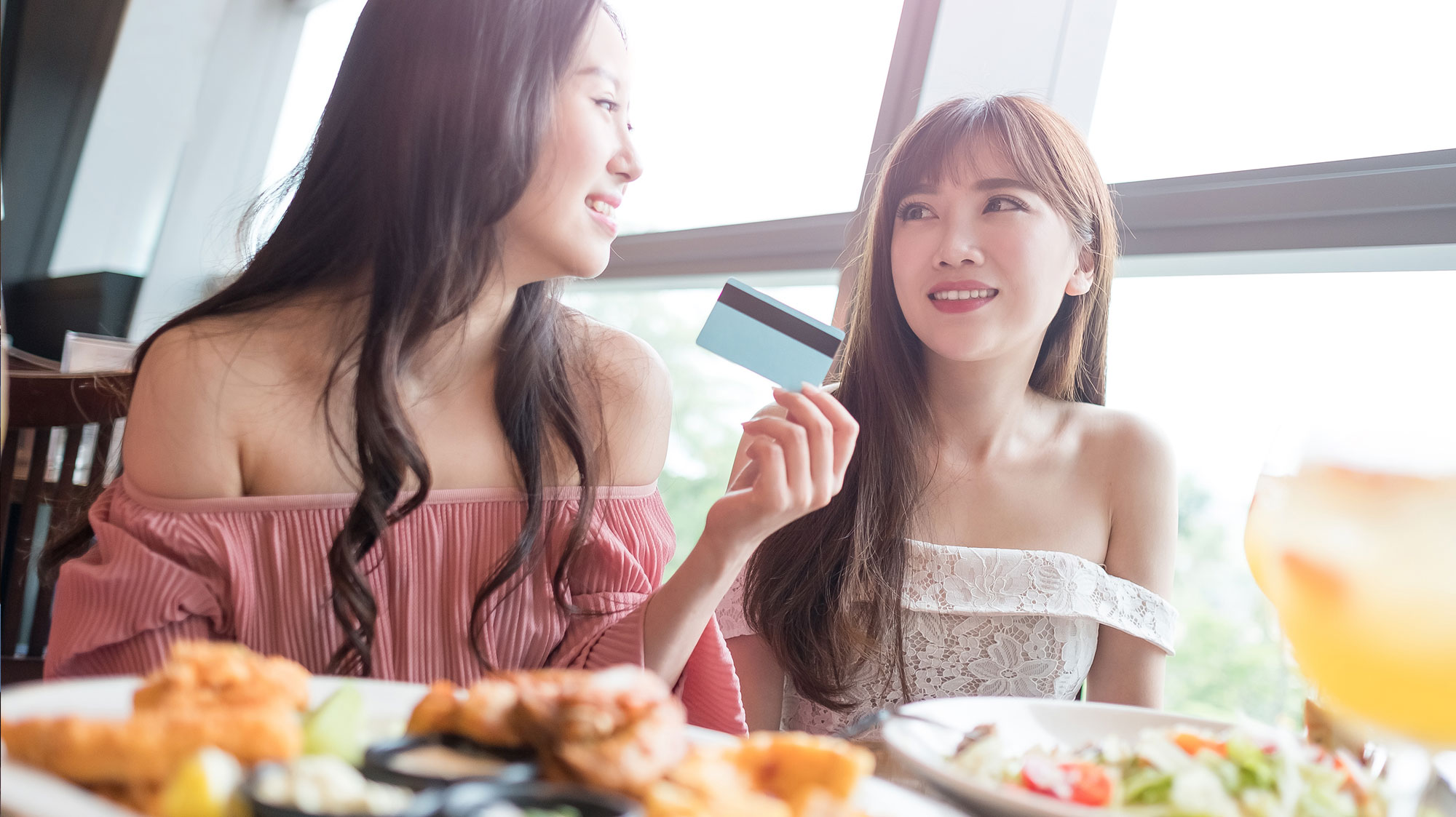 two woman eating lunch