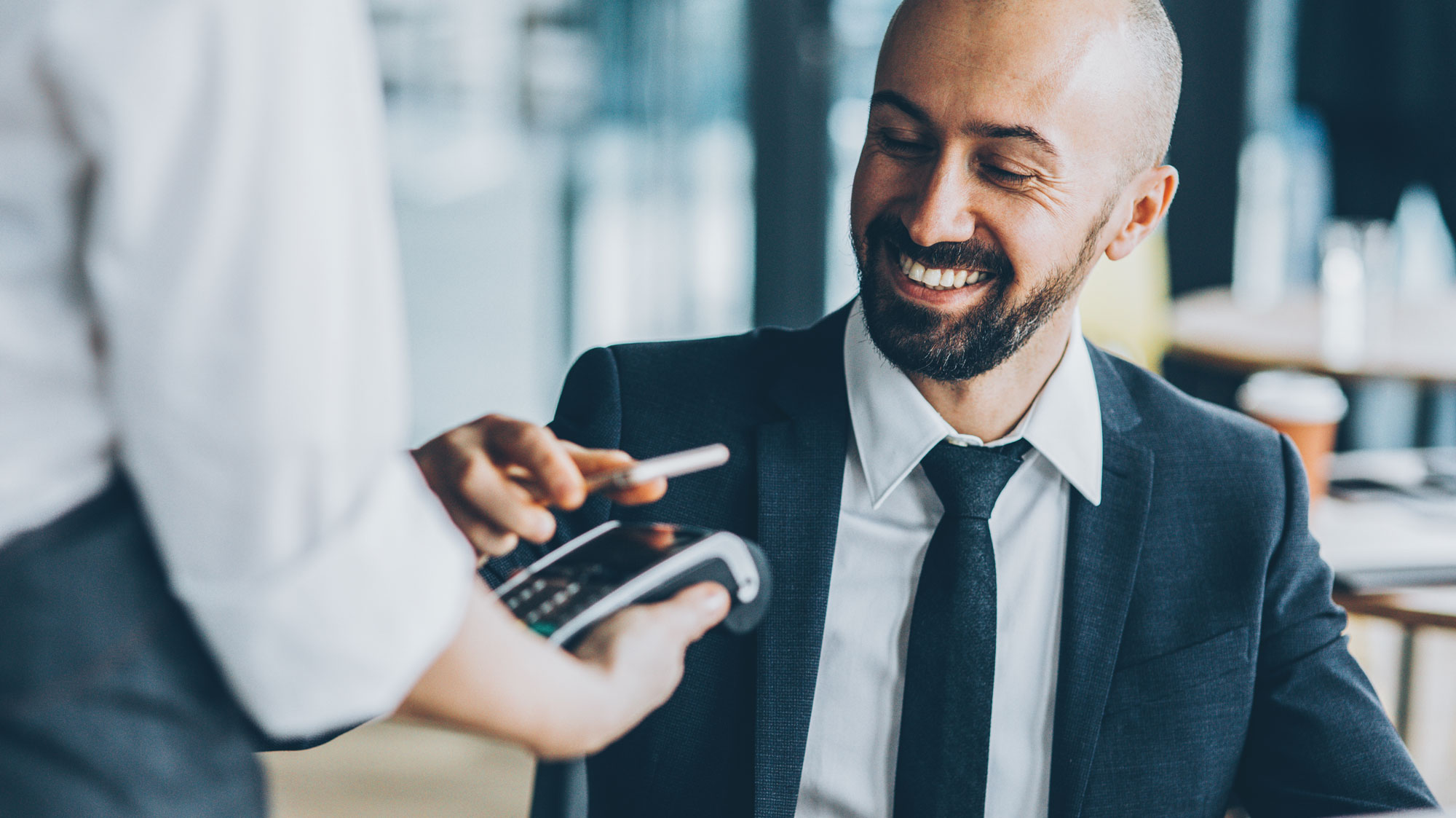 man paying with phone